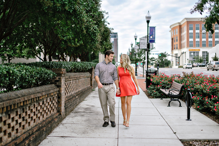 A photo of a couple walking down 3rd st.